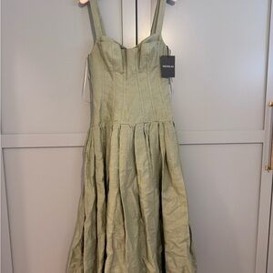 NICHOLAS Makenna midi-dress is crafted of linen drop-waist corset bodice